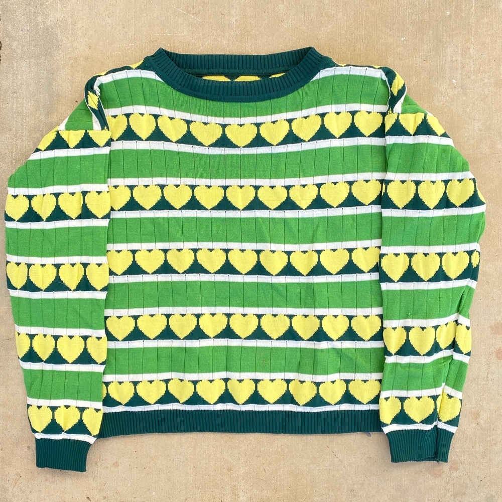 cute green knit sweater with yellow hearts